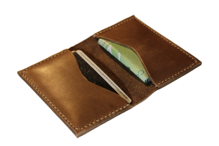 Open handmade bi-fold leather wallet with two card slots holding a card and folded bills